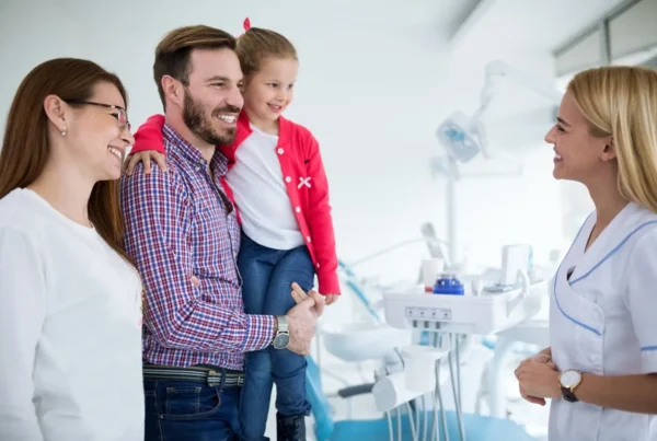 Family visits dentist in dental office